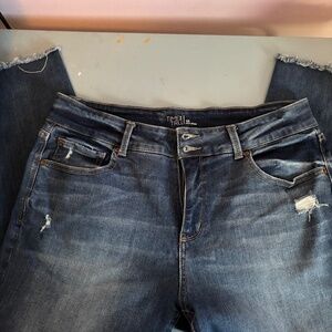 Women’s high rise blue jeans with frayed legs